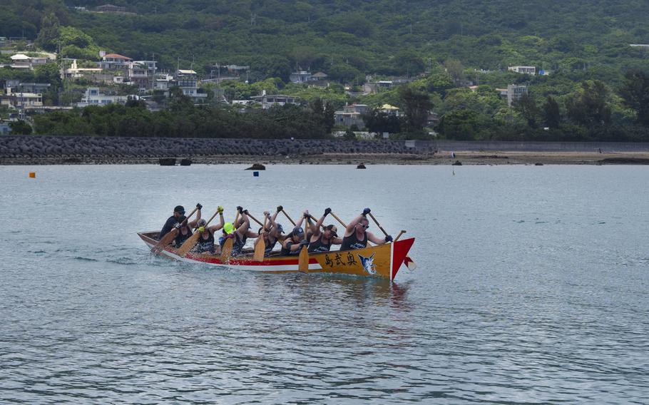 A team rowing a boat.
